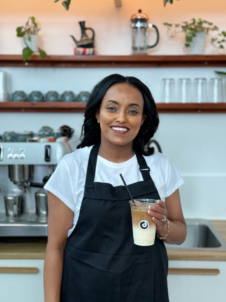 Barista with iced latte