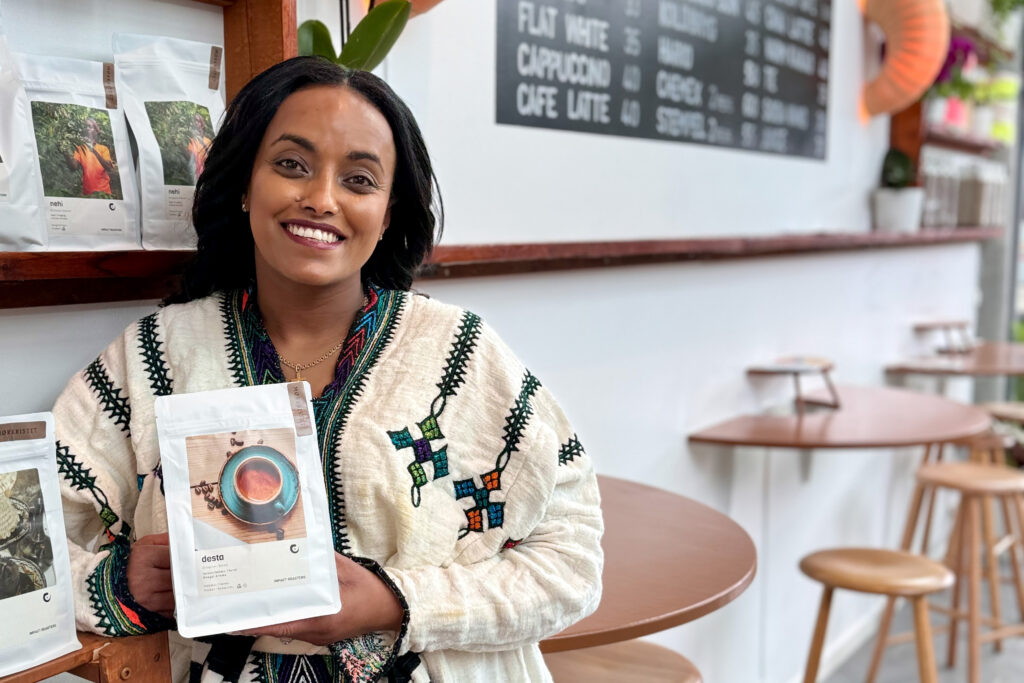 Woman with bag of coffee beans